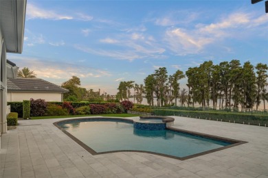 Stunning golf and lake views and beautifully updated grounds are on Isleworth Golf and Country Club in Florida - for sale on GolfHomes.com, golf home, golf lot