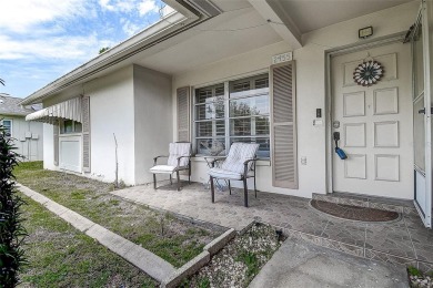 Nestled in the heart of Palm Harbor's sought-after Highland on Highland Lakes Executive Golf Course in Florida - for sale on GolfHomes.com, golf home, golf lot