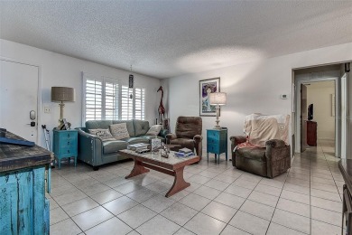 Nestled in the heart of Palm Harbor's sought-after Highland on Highland Lakes Executive Golf Course in Florida - for sale on GolfHomes.com, golf home, golf lot