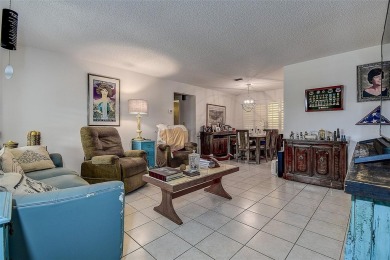 Nestled in the heart of Palm Harbor's sought-after Highland on Highland Lakes Executive Golf Course in Florida - for sale on GolfHomes.com, golf home, golf lot