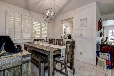Nestled in the heart of Palm Harbor's sought-after Highland on Highland Lakes Executive Golf Course in Florida - for sale on GolfHomes.com, golf home, golf lot