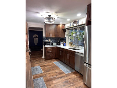 Welcome to your dream home at 6765 Overlook Drive, nestled in on Cypress Lake Country Club in Florida - for sale on GolfHomes.com, golf home, golf lot