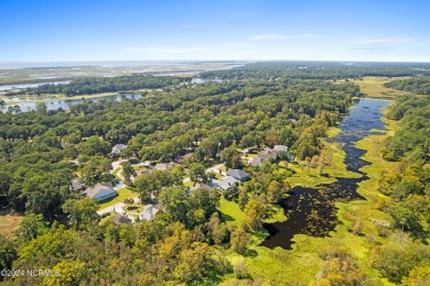 Beautiful home with stunning views must be seen to appreciate on Oyster Bay Golf Links in North Carolina - for sale on GolfHomes.com, golf home, golf lot