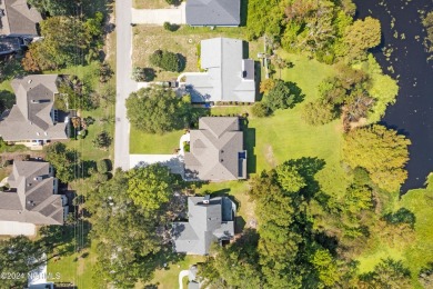 Beautiful home with stunning views must be seen to appreciate on Oyster Bay Golf Links in North Carolina - for sale on GolfHomes.com, golf home, golf lot