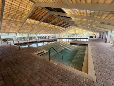 This beautifully maintained 2-bedroom, 2-bath, with den or 3rd on Monarch At Royal Highlands in Florida - for sale on GolfHomes.com, golf home, golf lot