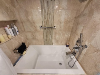 This exceptional corner unit offers stunning south and on Desert Island Golf and Country Club in California - for sale on GolfHomes.com, golf home, golf lot