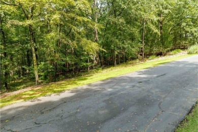 This .92-acre golf lot is nestled within the gates of Reynolds on Reynolds Lake Oconee - The Oconee in Georgia - for sale on GolfHomes.com, golf home, golf lot