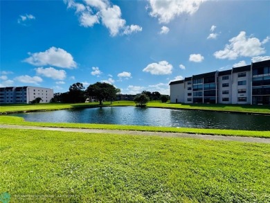 This inviting 55+ community condo offers an exceptional blend of on Sunrise Lakes Phase IV Golf Course in Florida - for sale on GolfHomes.com, golf home, golf lot