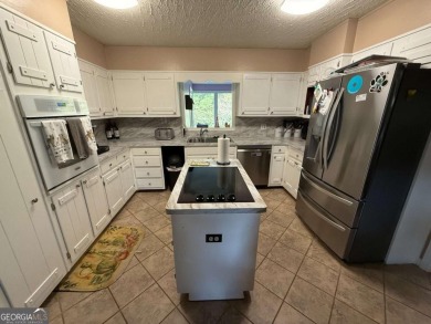 Wonderfully maintained and perfectly located, this 4 bedroom, 2 on Honey Creek Country Club in Georgia - for sale on GolfHomes.com, golf home, golf lot