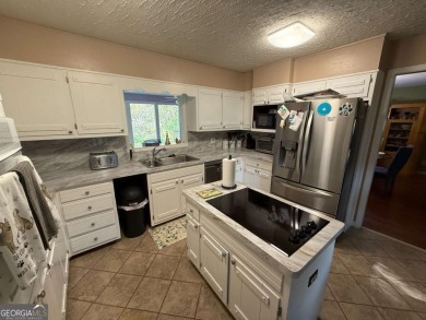 Wonderfully maintained and perfectly located, this 4 bedroom, 2 on Honey Creek Country Club in Georgia - for sale on GolfHomes.com, golf home, golf lot