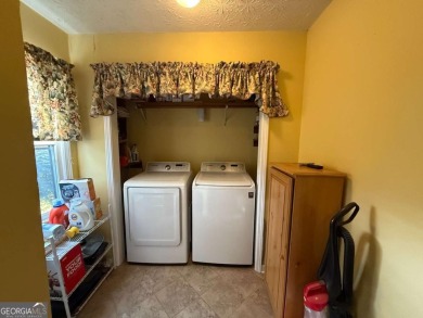 Wonderfully maintained and perfectly located, this 4 bedroom, 2 on Honey Creek Country Club in Georgia - for sale on GolfHomes.com, golf home, golf lot