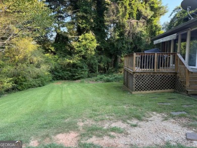 Wonderfully maintained and perfectly located, this 4 bedroom, 2 on Honey Creek Country Club in Georgia - for sale on GolfHomes.com, golf home, golf lot