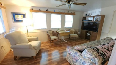 SO MUCH TO OFFER IN THIS ONE BEDROOM, 1 1/2 BATH MOBILE HOME IN on River Run Golf Links in Florida - for sale on GolfHomes.com, golf home, golf lot