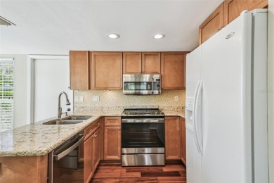 Step into Florida living at its finest with this beautifully on Highland Lakes Executive Golf Course in Florida - for sale on GolfHomes.com, golf home, golf lot