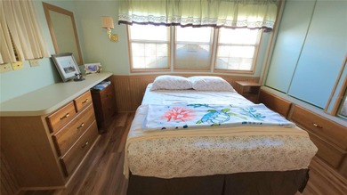 SO MUCH TO OFFER IN THIS ONE BEDROOM, 1 1/2 BATH MOBILE HOME IN on River Run Golf Links in Florida - for sale on GolfHomes.com, golf home, golf lot