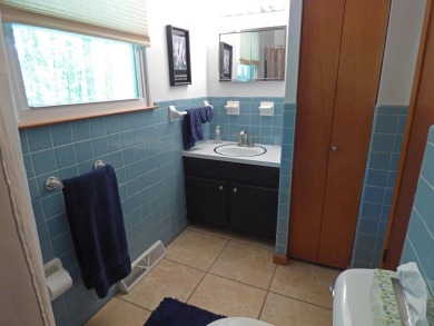 Built for comfort and ease of living, this home on Lake Navajo on Cherokee Village North Course in Arkansas - for sale on GolfHomes.com, golf home, golf lot