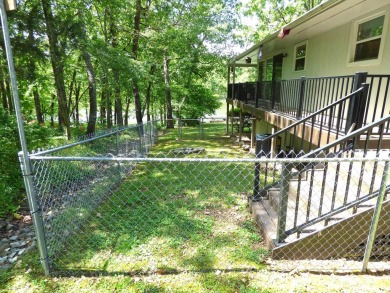 Built for comfort and ease of living, this home on Lake Navajo on Cherokee Village North Course in Arkansas - for sale on GolfHomes.com, golf home, golf lot