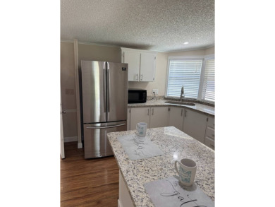 Welcome to this charming and well-maintained 2-bedroom, 2-bath on The Meadows At Countrywood in Florida - for sale on GolfHomes.com, golf home, golf lot