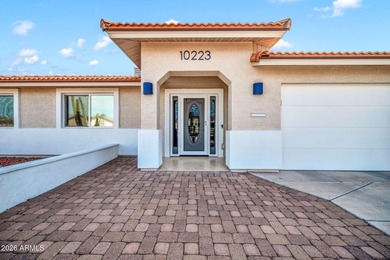 This exceptional custom Sun City home is ideally positioned on Sun City South Golf Course in Arizona - for sale on GolfHomes.com, golf home, golf lot