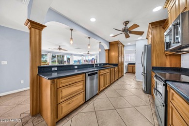 This exceptional custom Sun City home is ideally positioned on Sun City South Golf Course in Arizona - for sale on GolfHomes.com, golf home, golf lot