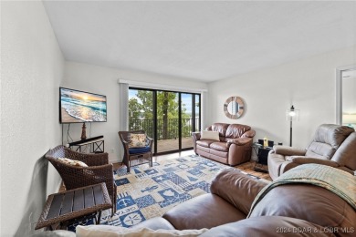 This beautiful 2-bedroom, 2-bath furnished end unit condominium on Seasons Ridge At Four Seasons in Missouri - for sale on GolfHomes.com, golf home, golf lot