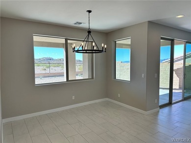 Welcome to your dream home in the prestigious Laughlin Ranch on Laughlin Ranch Golf Club in Arizona - for sale on GolfHomes.com, golf home, golf lot