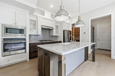 Experience a refined, low-maintenance lifestyle in this stunning on West End Golf Course in Florida - for sale on GolfHomes.com, golf home, golf lot