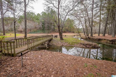 Discover your dream homesite on this expansive 2.35-acre estate on Pine Hill Country Club in Alabama - for sale on GolfHomes.com, golf home, golf lot
