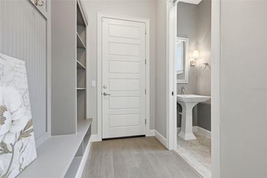 Experience a refined, low-maintenance lifestyle in this stunning on West End Golf Course in Florida - for sale on GolfHomes.com, golf home, golf lot