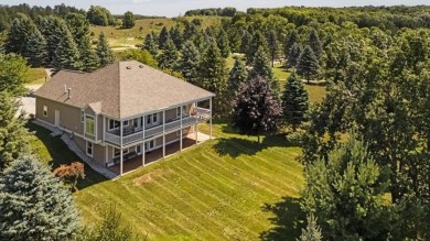 Welcome to your dream retreat at 5668 Golf Meadows Drive in on Shanty Creek Golf Course in Michigan - for sale on GolfHomes.com, golf home, golf lot