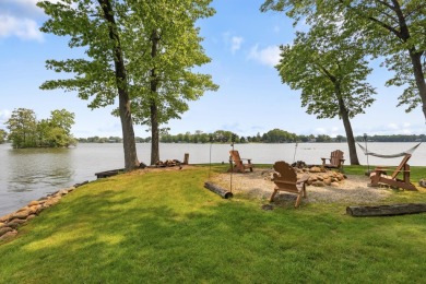 Comfortable and welcoming with 260 feet of water frontage, and on Island Hills Golf Club in Michigan - for sale on GolfHomes.com, golf home, golf lot
