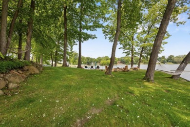Comfortable and welcoming with 260 feet of water frontage, and on Island Hills Golf Club in Michigan - for sale on GolfHomes.com, golf home, golf lot
