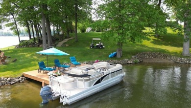 Comfortable and welcoming with 260 feet of water frontage, and on Island Hills Golf Club in Michigan - for sale on GolfHomes.com, golf home, golf lot