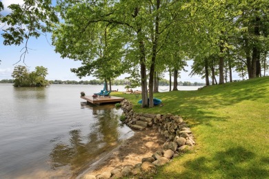 Comfortable and welcoming with 260 feet of water frontage, and on Island Hills Golf Club in Michigan - for sale on GolfHomes.com, golf home, golf lot