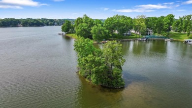 Comfortable and welcoming with 260 feet of water frontage, and on Island Hills Golf Club in Michigan - for sale on GolfHomes.com, golf home, golf lot