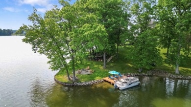 Comfortable and welcoming with 260 feet of water frontage, and on Island Hills Golf Club in Michigan - for sale on GolfHomes.com, golf home, golf lot