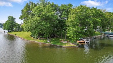 Comfortable and welcoming with 260 feet of water frontage, and on Island Hills Golf Club in Michigan - for sale on GolfHomes.com, golf home, golf lot