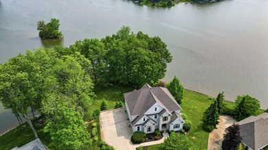 Comfortable and welcoming with 260 feet of water frontage, and on Island Hills Golf Club in Michigan - for sale on GolfHomes.com, golf home, golf lot