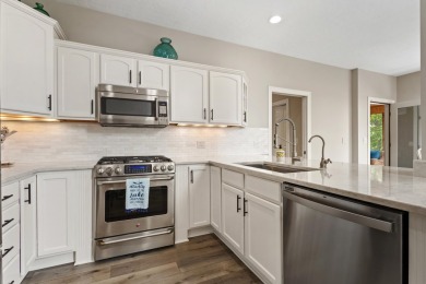 Comfortable and welcoming with 260 feet of water frontage, and on Island Hills Golf Club in Michigan - for sale on GolfHomes.com, golf home, golf lot