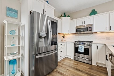 Comfortable and welcoming with 260 feet of water frontage, and on Island Hills Golf Club in Michigan - for sale on GolfHomes.com, golf home, golf lot