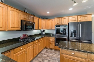 This beautiful 2-story home overlooks the par-3 4th hole at on Hunters Ridge Golf Course in Iowa - for sale on GolfHomes.com, golf home, golf lot