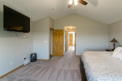 This beautiful 2-story home overlooks the par-3 4th hole at on Hunters Ridge Golf Course in Iowa - for sale on GolfHomes.com, golf home, golf lot