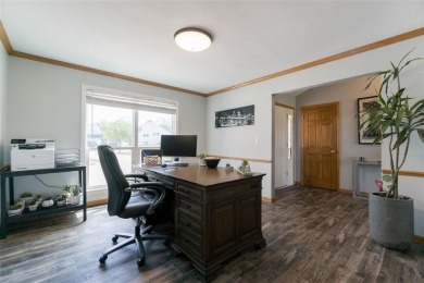 This beautiful 2-story home overlooks the par-3 4th hole at on Hunters Ridge Golf Course in Iowa - for sale on GolfHomes.com, golf home, golf lot