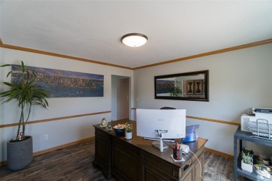 This beautiful 2-story home overlooks the par-3 4th hole at on Hunters Ridge Golf Course in Iowa - for sale on GolfHomes.com, golf home, golf lot
