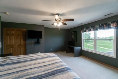 This beautiful 2-story home overlooks the par-3 4th hole at on Hunters Ridge Golf Course in Iowa - for sale on GolfHomes.com, golf home, golf lot