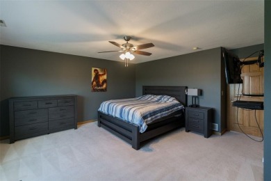This beautiful 2-story home overlooks the par-3 4th hole at on Hunters Ridge Golf Course in Iowa - for sale on GolfHomes.com, golf home, golf lot