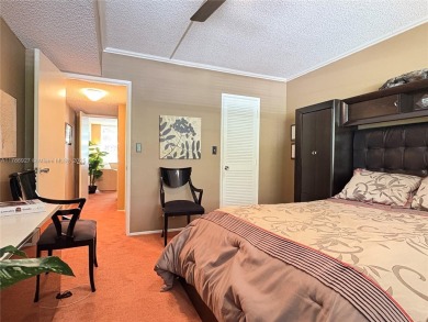BEAUTIFUL GOLF COURSE VIEWS provide a serene environment for on Palm-Aire Country Club and Resort - Palms in Florida - for sale on GolfHomes.com, golf home, golf lot