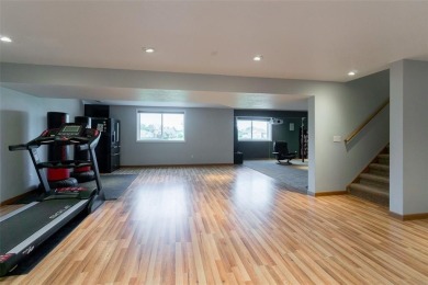 This beautiful 2-story home overlooks the par-3 4th hole at on Hunters Ridge Golf Course in Iowa - for sale on GolfHomes.com, golf home, golf lot