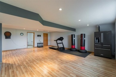 This beautiful 2-story home overlooks the par-3 4th hole at on Hunters Ridge Golf Course in Iowa - for sale on GolfHomes.com, golf home, golf lot
