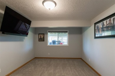 This beautiful 2-story home overlooks the par-3 4th hole at on Hunters Ridge Golf Course in Iowa - for sale on GolfHomes.com, golf home, golf lot